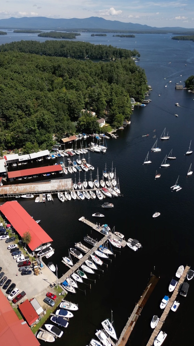 Aerial drone view of marina with sailboats on a New England lake